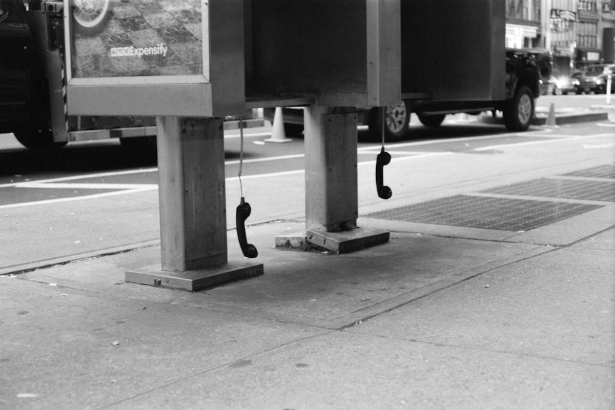 pay phone with receiver dangling